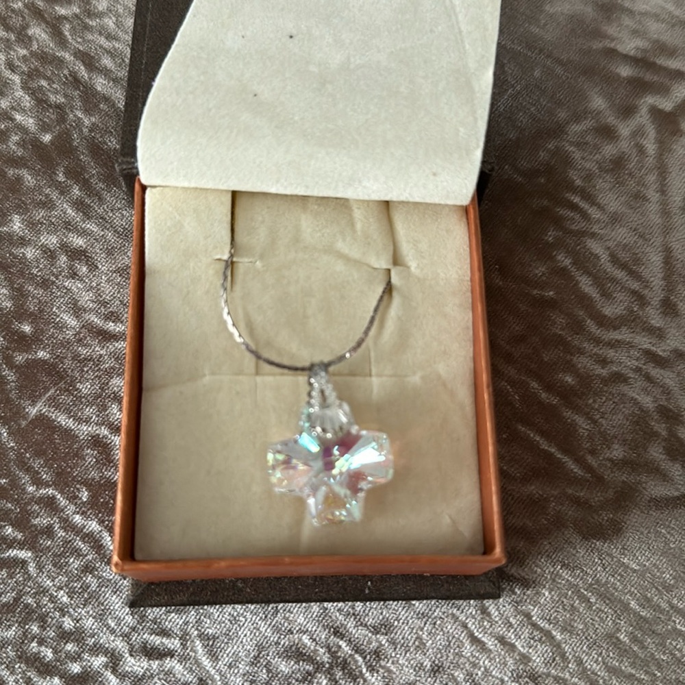 Crystal and silver cross necklace.
